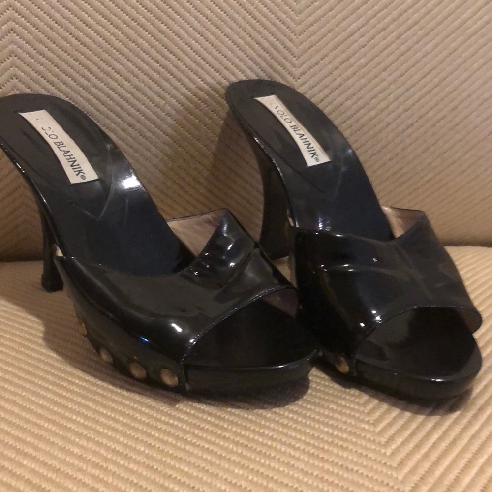 Vintage black heels with gold detail.